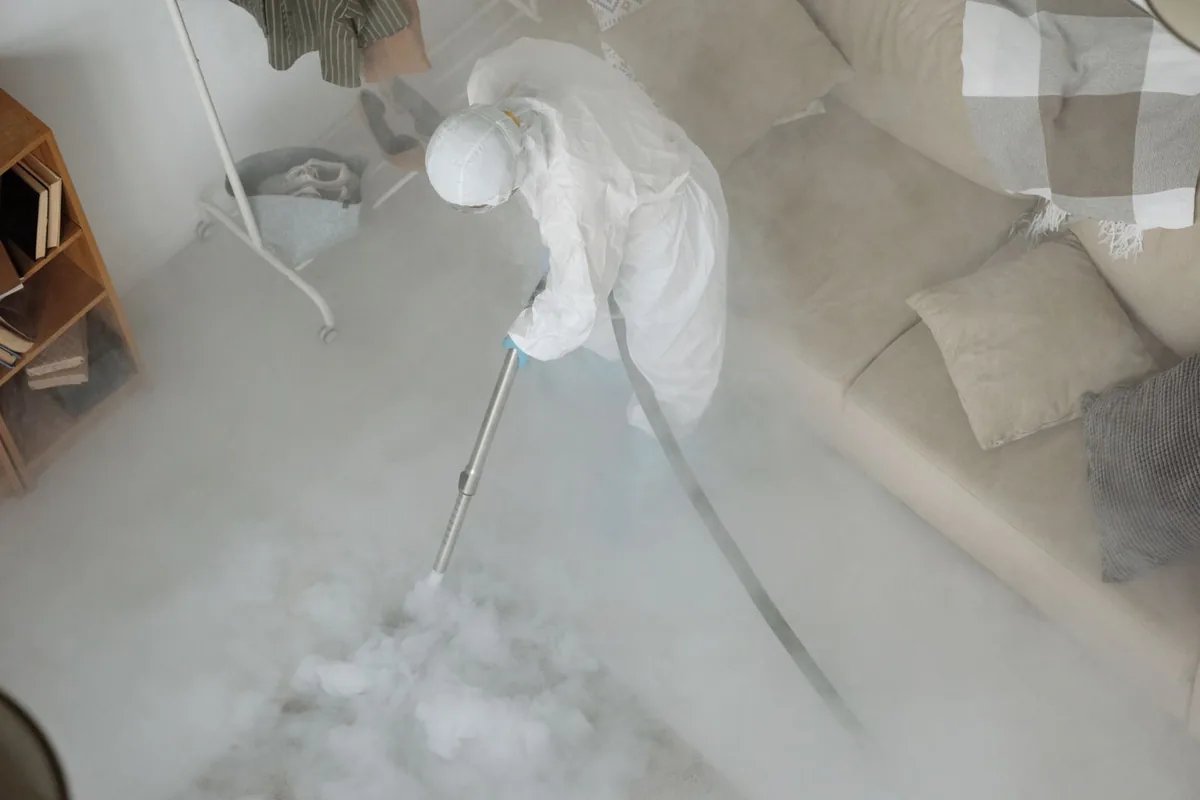 Biohazard cleanup technician in protective equipment, Woodlawn, OH